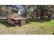 Charming vintage house nestled in a yard with mature trees at 1213 Cr 652, Bushnell, FL 33513