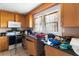 A kitchen featuring a window over the sink and a combination microwave hood at 1213 Cr 652, Bushnell, FL 33513