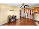 An interior view of a living room with an electric fireplace and access to the kitchen at 1213 Cr 652, Bushnell, FL 33513