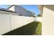 A spacious backyard bordered by a white vinyl fence for privacy, ideal for outdoor activities at 13812 Cepheus Dr, Orlando, FL 32828