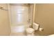 Bathroom featuring a tub and shower combination and a white toilet at 13812 Cepheus Dr, Orlando, FL 32828