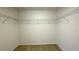 Walk-in closet with white walls and wire shelving at 13812 Cepheus Dr, Orlando, FL 32828