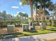 View of the Community Pool and Building, surrounded by lush landscaping at 13812 Cepheus Dr, Orlando, FL 32828