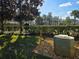 View of the Community Pool and Building, surrounded by lush landscaping at 13812 Cepheus Dr, Orlando, FL 32828