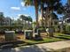 View of the Community Pool and Building, surrounded by lush landscaping at 13812 Cepheus Dr, Orlando, FL 32828