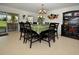 Formal dining area features stylish dark wood furniture and sliding glass doors at 13812 Cepheus Dr, Orlando, FL 32828