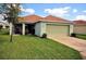 Single Gathering home with a two-car garage and well-kept lawn at 13812 Cepheus Dr, Orlando, FL 32828