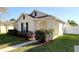 Well-kept front yard landscaping enhances the charm of this inviting single-Gathering home at 13812 Cepheus Dr, Orlando, FL 32828