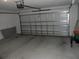 Spacious two-car garage with clean concrete floor and white walls at 13812 Cepheus Dr, Orlando, FL 32828