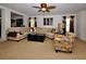 Spacious living room featuring neutral tones, a ceiling fan, and comfortable seating at 13812 Cepheus Dr, Orlando, FL 32828