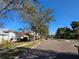 Scenic street view with sidewalks and mature trees, showing the desirable neighborhood at 13812 Cepheus Dr, Orlando, FL 32828