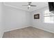 A bedroom features tile floors, neutral walls, a ceiling fan, and one window at 17826 Blazing Star Cir, Clermont, FL 34714