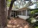 Relaxing screened in back porch area perfect for outdoor entertainment and relaxation at 22 Poinsettia Dr, Deland, FL 32724