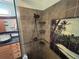This bathroom features a tiled walk-in shower with mosaic detail and a vanity at 22 Poinsettia Dr, Deland, FL 32724