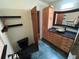 The bathroom showcases a wood cabinet vanity, granite counters, and a black toilet and fixtures at 22 Poinsettia Dr, Deland, FL 32724
