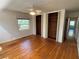 The bedroom features hardwood floors, a window, and closet space at 22 Poinsettia Dr, Deland, FL 32724