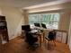Bedroom featuring a window and wood floors used as an office space at 22 Poinsettia Dr, Deland, FL 32724