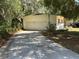 Detached garage with ample parking space, and access to the main house at 22 Poinsettia Dr, Deland, FL 32724