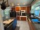 Spacious kitchen with wood cabinets, an island, and stainless steel appliances at 22 Poinsettia Dr, Deland, FL 32724