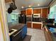 Updated kitchen boasts stainless steel appliances, stylish cabinetry, and an island for food preparation or casual dining at 22 Poinsettia Dr, Deland, FL 32724