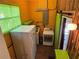 This laundry room features a refrigerator, washer, dryer, and storage at 22 Poinsettia Dr, Deland, FL 32724