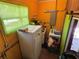Functional laundry area with appliances, storage, and a convenient door to the outside at 22 Poinsettia Dr, Deland, FL 32724