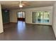 Bright living area featuring tile floors, neutral walls, with easy access to the screened-in porch at 22 Poinsettia Dr, Deland, FL 32724