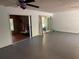 Large living area with tile flooring and access to a sun room and living room at 22 Poinsettia Dr, Deland, FL 32724