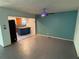 Open-concept living space showcasing tile flooring, neutral paint, and views into the adjacent kitchen area at 22 Poinsettia Dr, Deland, FL 32724