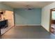 Open living room with tile flooring, neutral paint, and access to other areas of the home at 22 Poinsettia Dr, Deland, FL 32724