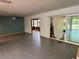 Spacious living room featuring a ceiling fan, a slider to the outside, and doorway to the sun room at 22 Poinsettia Dr, Deland, FL 32724
