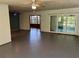 Sun-filled living room with tile flooring connects seamlessly to a bright sunroom, perfect for relaxation at 22 Poinsettia Dr, Deland, FL 32724