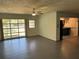 Spacious living area with tile flooring, natural light, and seamless flow into the adjacent kitchen at 22 Poinsettia Dr, Deland, FL 32724