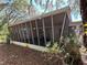 Enclosed porch with lots of light featuring screens and a metal roof at 22 Poinsettia Dr, Deland, FL 32724