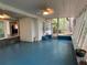 Screened porch with ceiling fans and view of the outdoor greenery at 22 Poinsettia Dr, Deland, FL 32724