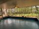 Screened porch offers an abundance of natural light and a view of nature at 22 Poinsettia Dr, Deland, FL 32724