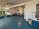 Blue painted screened porch with ceiling fans and views of the surrounding landscape at 22 Poinsettia Dr, Deland, FL 32724