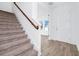 Welcoming foyer featuring a staircase with a wooden railing and access to other rooms at 2222 Derwent Dr, Davenport, FL 33896