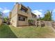 Backyard view of the home, featuring a wooden deck and lush green lawn at 229 Springside Rd, Longwood, FL 32779