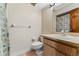 Well-lit bathroom with a single sink vanity and a shower and bathtub combination at 229 Springside Rd, Longwood, FL 32779