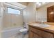 Bright bathroom with a tub/shower combo and wooden vanity at 229 Springside Rd, Longwood, FL 32779