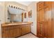 Bathroom featuring double sinks, ample counter space and wood cabinetry, offering convenience and storage at 229 Springside Rd, Longwood, FL 32779