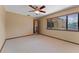 Bedroom featuring a ceiling fan, window and carpet creating a comfortable retreat at 229 Springside Rd, Longwood, FL 32779