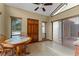 Inviting breakfast nook with tile floor, wooden table, and natural light from large windows and sliding doors at 229 Springside Rd, Longwood, FL 32779