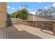 Large wooden deck surrounded by lush greenery, perfect for outdoor relaxation and entertaining at 229 Springside Rd, Longwood, FL 32779