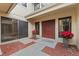 Welcoming home entrance with double doors, complemented by potted plants and a cozy walkway at 229 Springside Rd, Longwood, FL 32779