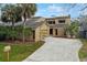 Inviting two-story home with a brick and siding exterior, featuring a spacious driveway and mature landscaping at 229 Springside Rd, Longwood, FL 32779