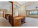 Hallway featuring a vanity area, chandelier and window allowing natural light to flood the space at 229 Springside Rd, Longwood, FL 32779