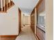 Inviting hallway featuring tile flooring, wooden trim, and doors at 229 Springside Rd, Longwood, FL 32779