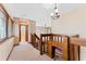 Carpeted upstairs hallway with a charming built-in desk and chair at 229 Springside Rd, Longwood, FL 32779